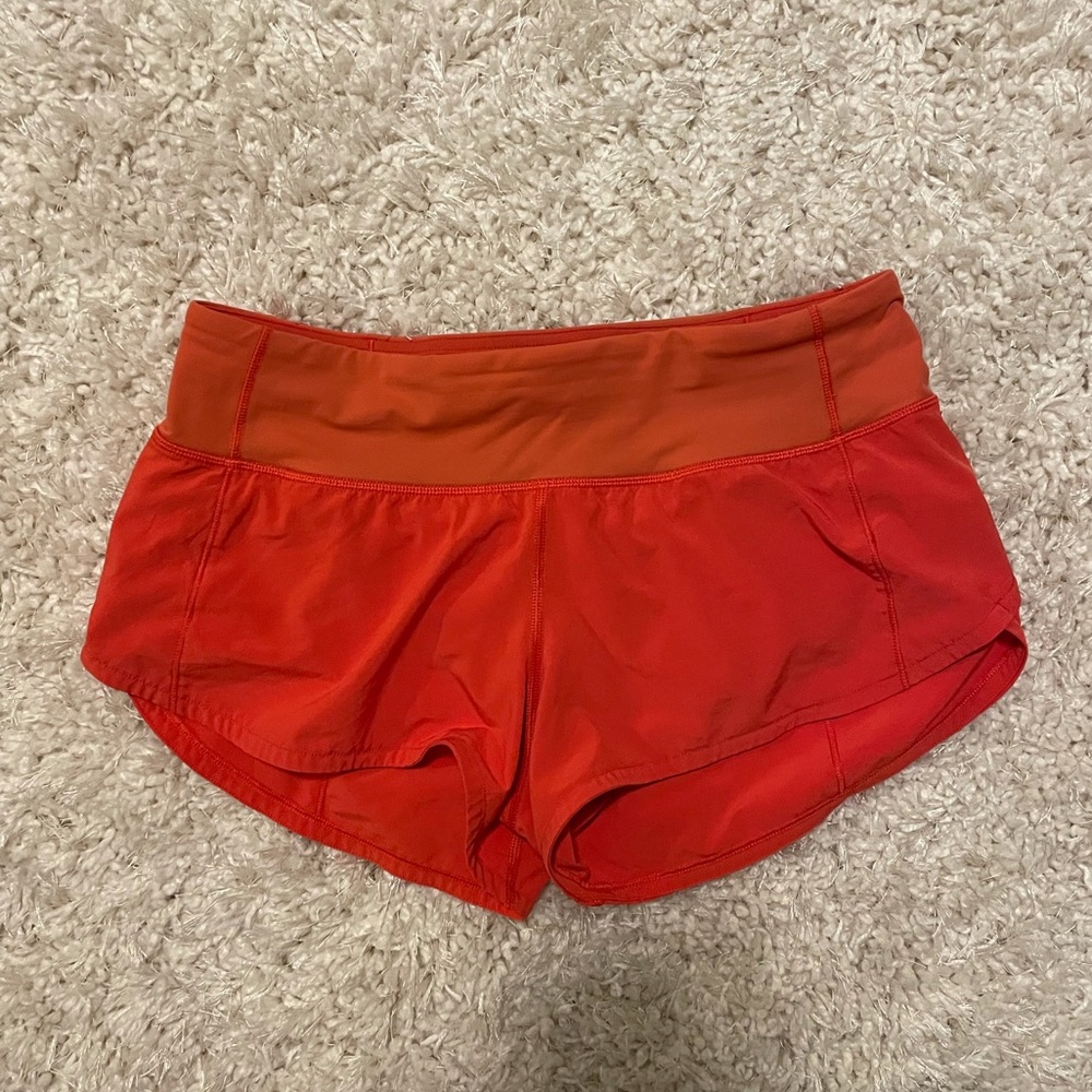 Bright orange Lululemon Speed Up Shorts